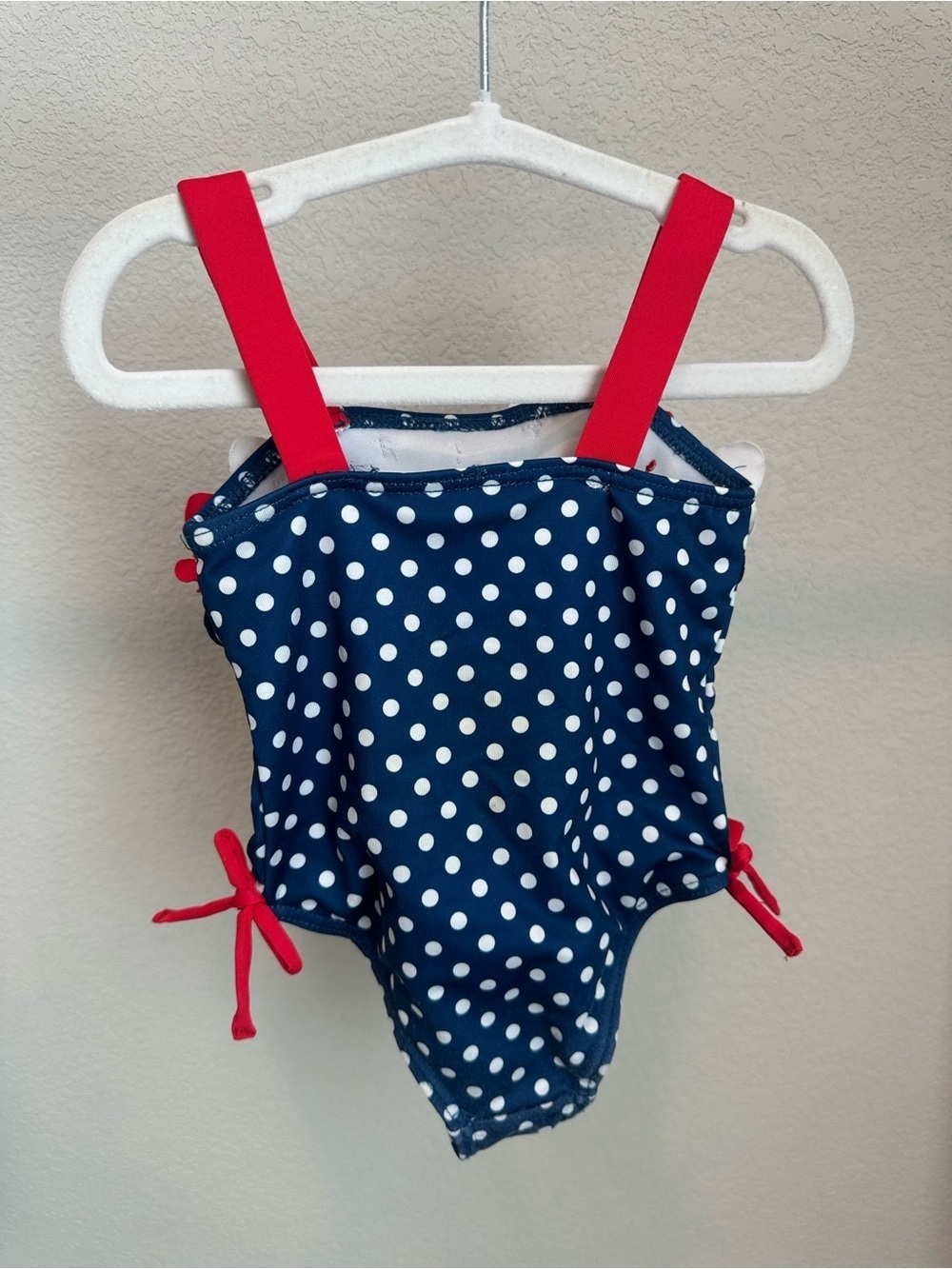 Classic preppy Penelope Mack Navy Polka Dot Floral Ruffle One-Piece Swim - Picture 3 of 3